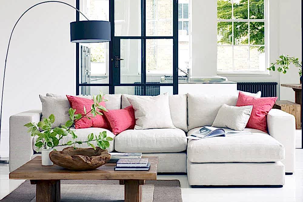 how to add colour to your home Loft corner unit sofa with pink cushions